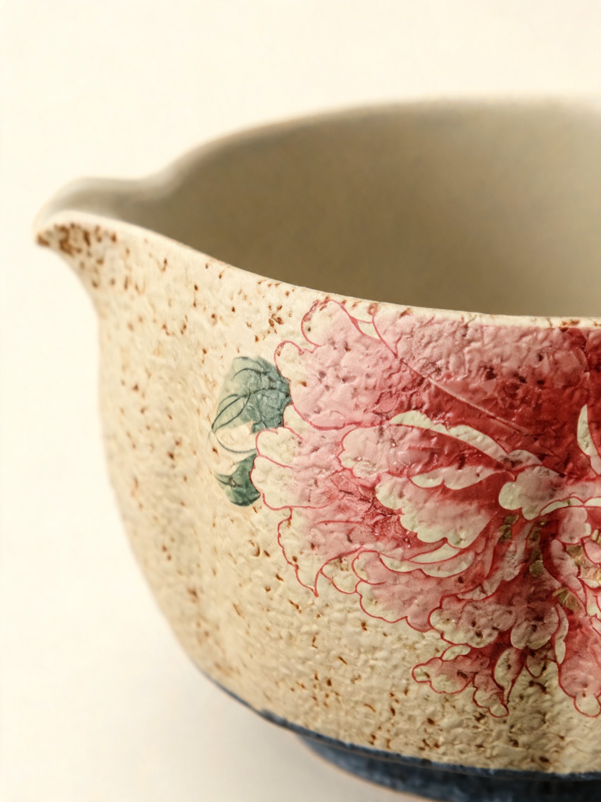 Detail of the pink peony motif and fire-stone red base