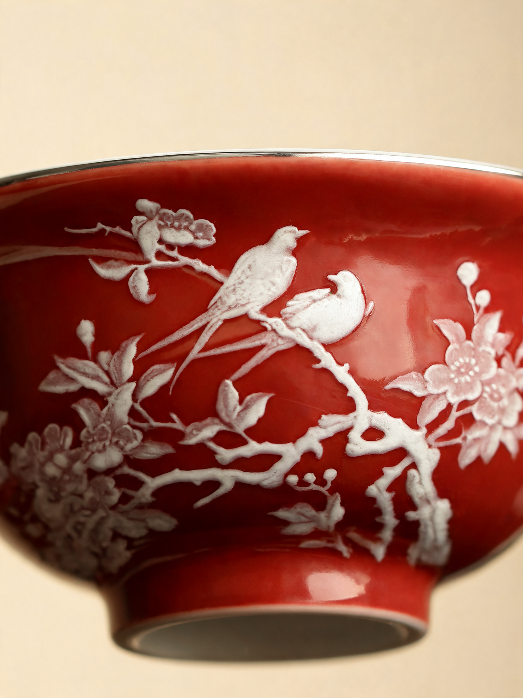 Detail of the magpie and plum blossom motif on coral red glaze