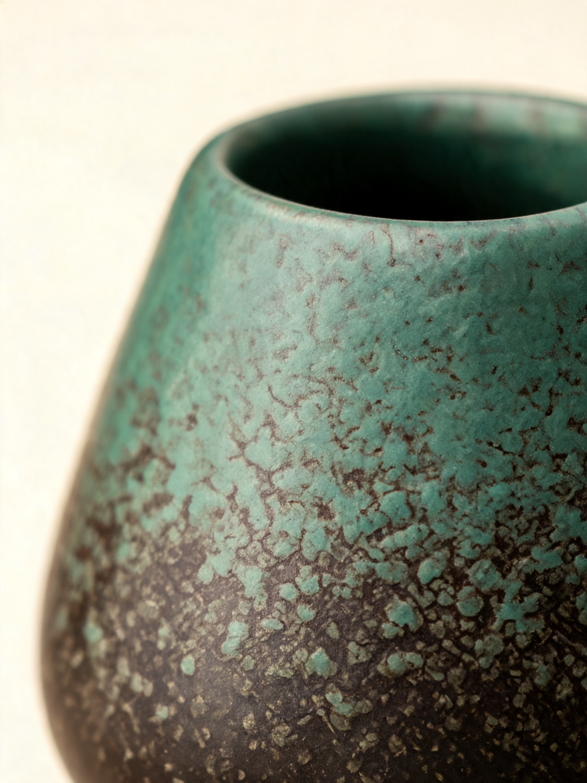 Detail of the moss green to brown black glaze transition