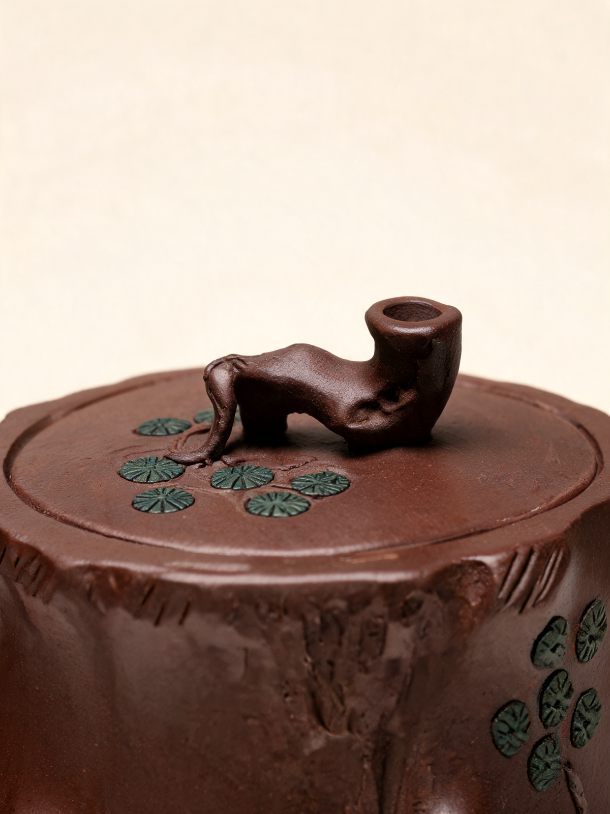 Close-up of the raised green accents on the Shuzhuang teapot