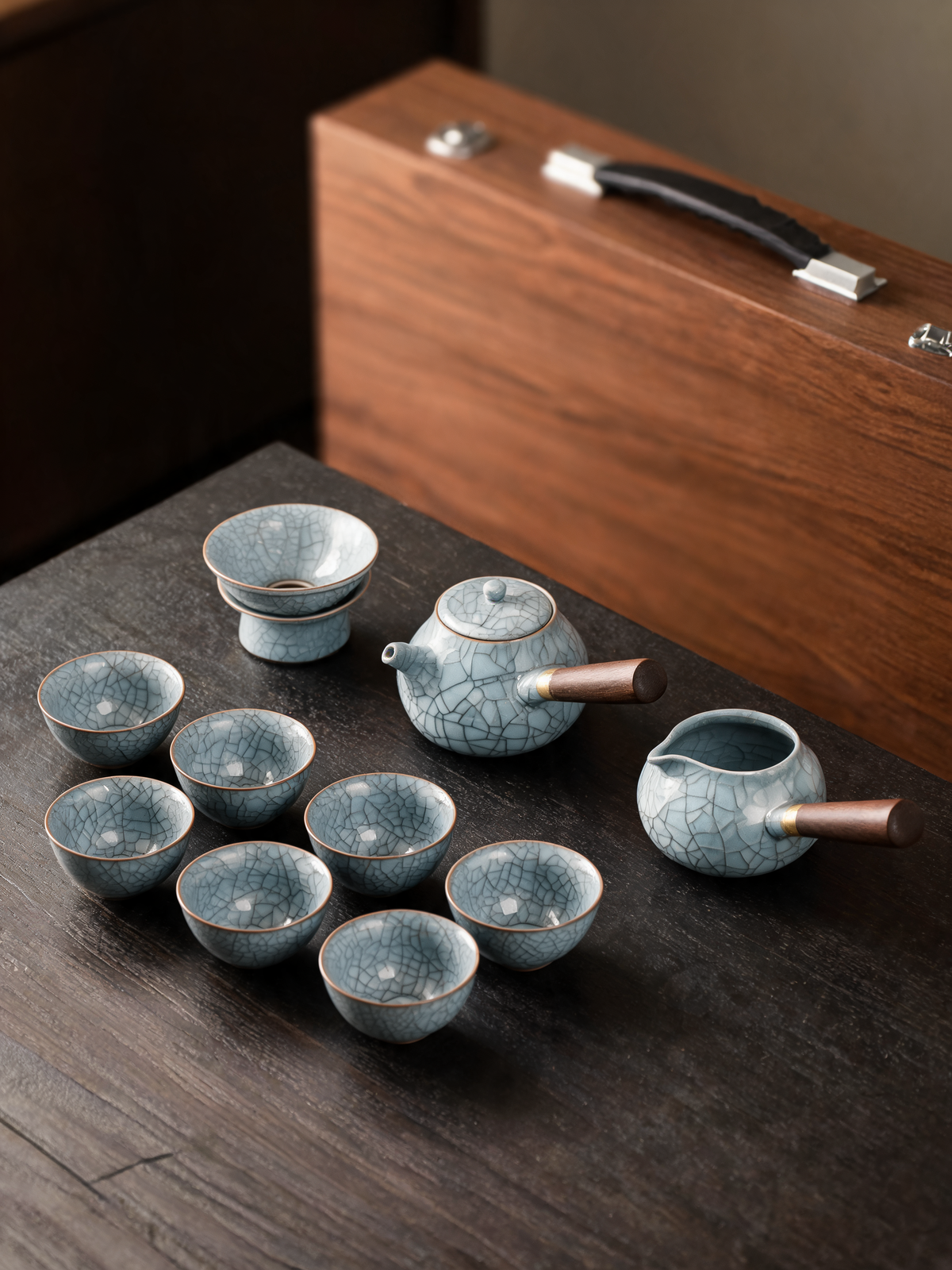 Tiexian tea cups with copper-toned rims and wood handles