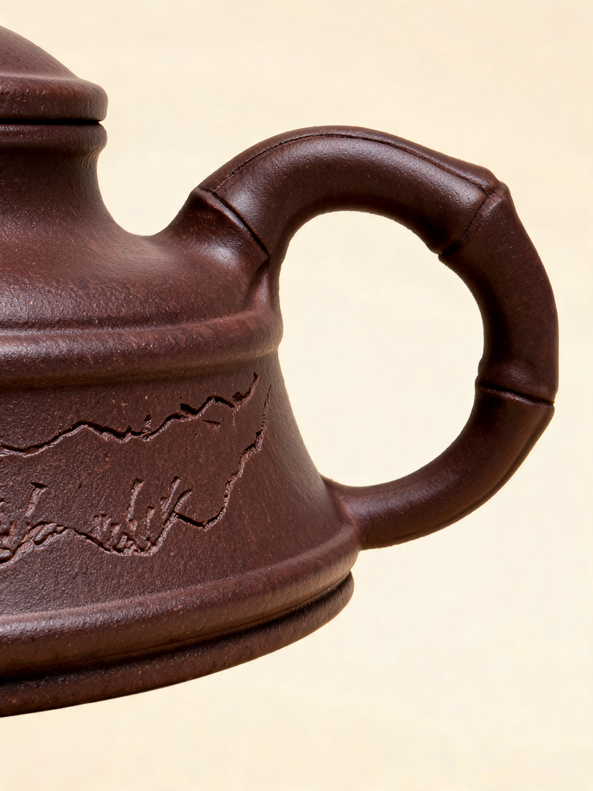 Zhuyun teapot in purple Zisha clay shown from a side angle